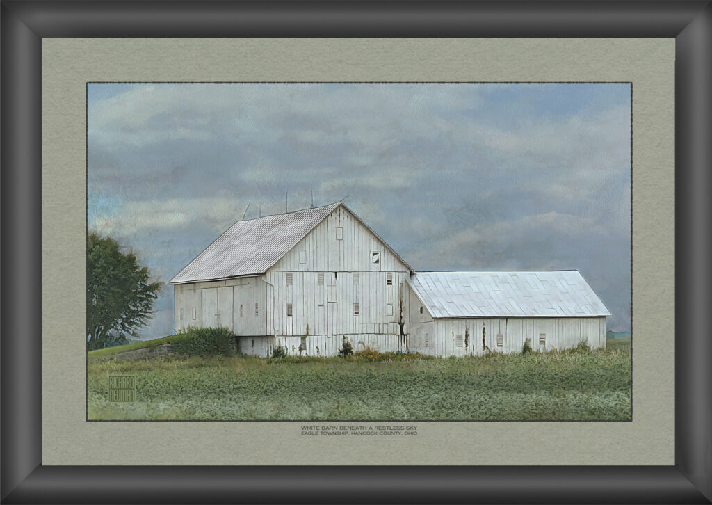 Impressionistic watercolor of an old white barn and adjoining shed beneath a cloudy sky in a rural Ohio field